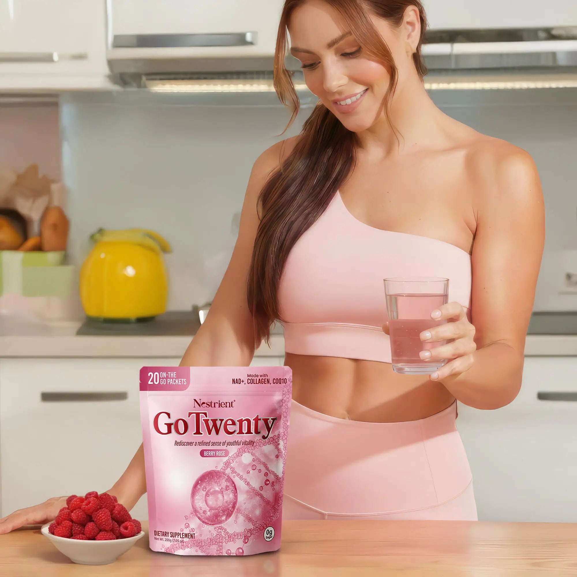 Nestrient GoTwenty youthful vitality powdered drink mix in berry rose flavor with NAD+, collagen, and CoQ10 in a glass.