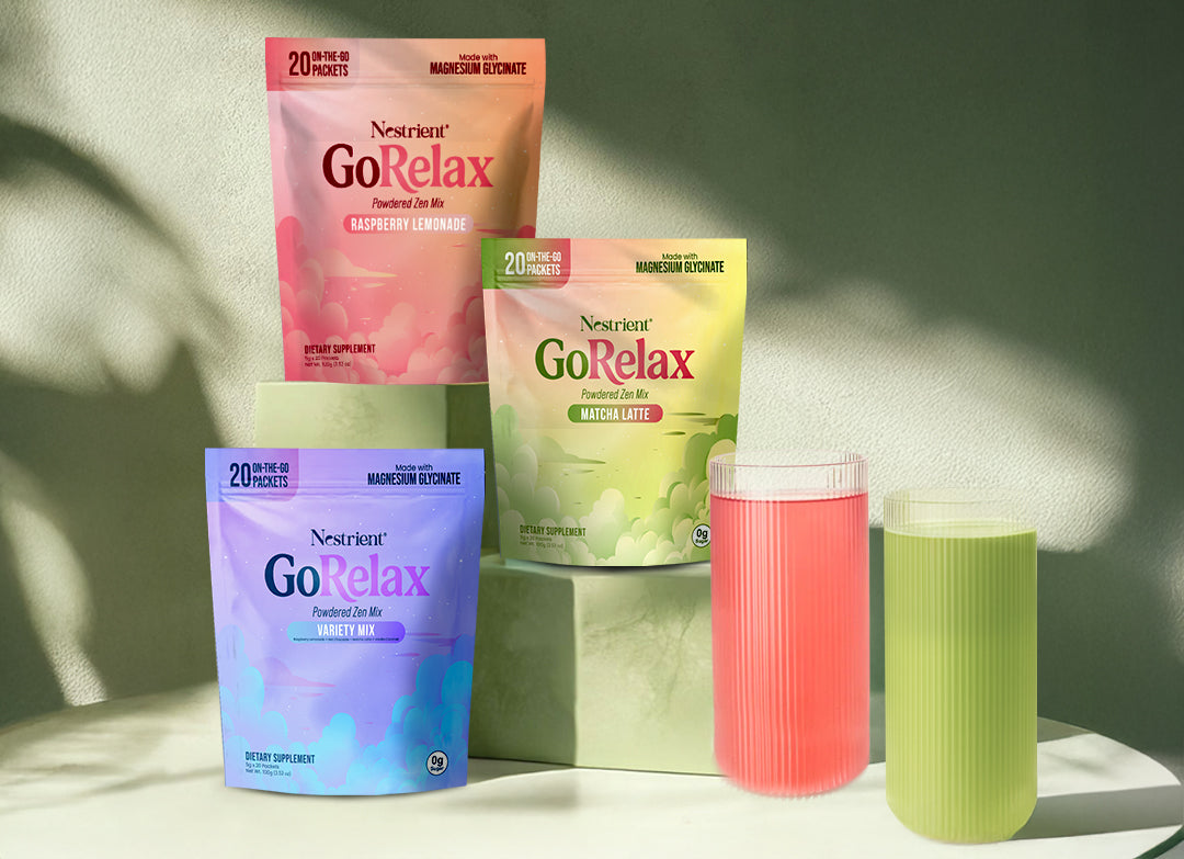 Three packages of Nestlé GoRelax on a light surface with two colorful cups.