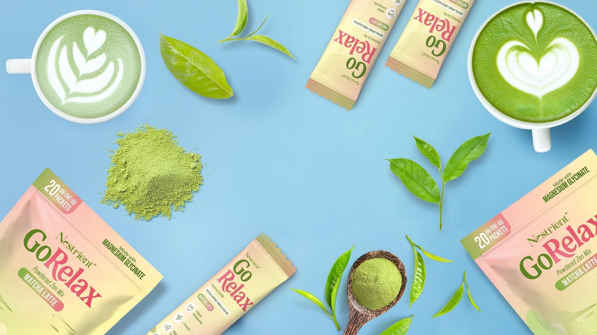 Green tea products including matcha powder, tea bags, and a latte on a blue background