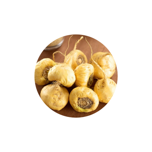 Group of yellow root vegetables on a wooden surface