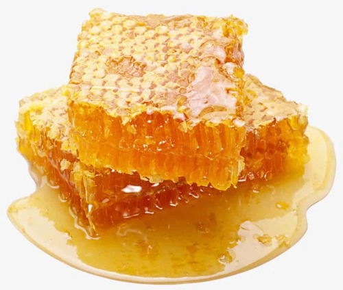 Honeycomb with honey on a white background