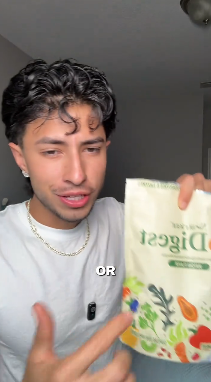 Person holding a package labeled 'Digezi' with text 'OR' in a casual setting.